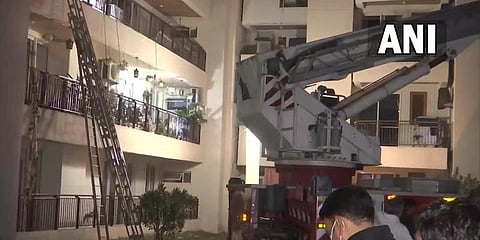 Teams from the NDRF and the SDRF are carrying out the rescue work at the partially collapsed apartment building in Gurugram. (Photo | ANI)