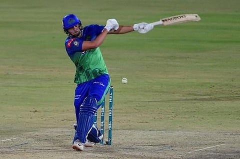 Multan Sultans' Tim David plays a shot during the Pakistan Super League (PSL) match between Multan Sultans and Peshawar Zalmi at the National Cricket Stadium in Karachi. (File | AFP)