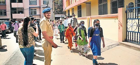 Police personnel deputed outside Vidyasagar English Public School in Bengaluru on Friday following a protest by parents against alleged discrimination by a teacher