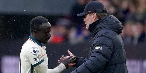 Liverpool manager Jurgen Klopp (R) shakes hands with Sadio Mane during the EPL soccer match between Burnley and Liverpool at Turf Moor, in Burnley. (Photo | AP)