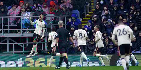 Liverpool's Fabinho (L) celebrates after scoring a goal during an EPL match against Burnley in Turf Moor. (Photo| AP)