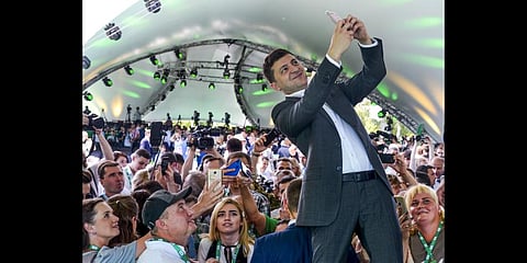 Ukrainian President Volodymyr Zelenskyy takes a selfie at the first congress of his party called Servant of the People in the city Botanical Garden, Kiev.(File Photo | AP)
