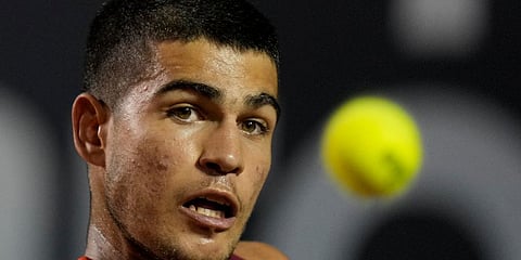 Carlos Alcaraz of Spain returns the ball to Jaume Munar of Spain during a match of Rio Open Tennis tournament in Rio de Janeiro, Brazil, Monday, Feb. 14, 2022. (Photo | AP)