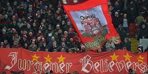 Liverpool fans cheer prior to the start of the English Premier League soccer match between Liverpool and Leicester City at Anfield stadium in Liverpool, England, Thursday, Feb. 10, 2022. (Photo | AP)