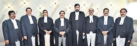 Seven new judges with AP High Court Chief Justice Prashant Kumar Mishra (4th left) after taking oath in the High Court of Andhra Pradesh on Monday I Express