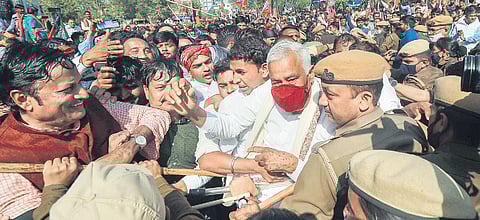 Police stop BJP leader Kirodi Lal Meena and other activists in Jaipur on Tuesday. (Photo | PTI)