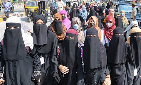 The students of Government Empress PU College for girls taking out a protest march after they were disallowed to attend the classes wearing burkha and hijab in Tumakuru on Wednesday. (Photo | EPS)