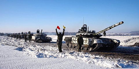 Russian army tanks stand ready to move back to their permanent base after drills in Russia. Could signify Kremlin would like to lower the temperature.(Photo | AP)