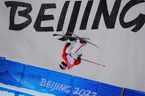 China's He Binghan competes during the men's halfpipe qualification at the 2022 Winter Olympics ( Photo | AP)