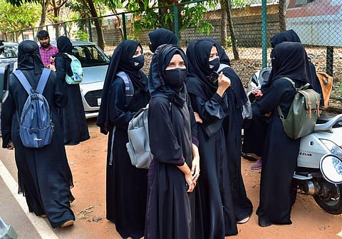 Students leave after they were not allowed to attend classes while wearing Hijab, at Dr G Shankar Government Women's First Grade College in Udupi, Thursday, Feb. 17, 2022. (Photo | PTI)