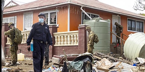 Australian Defence Force and Department of Foreign Affairs & Trade crisis response team personnel make a damage assessment operation in Tonga.(Photo | AP)