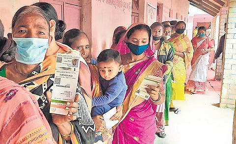 Women voters standing in queue at a booth in MV-7 of Malkangiri block | Express