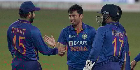 India's Ravi Bishnoi (C) celebrates with teammates the dismissal of West Indies' Roston Chase during the first T20I cricket match between India and West Indies in Kolkata. (Photo | AP)