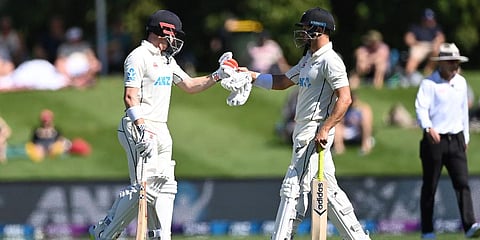 New Zealand's Neil Wagner and Henry Nicholls bump fists during Day 2 of their first Test against South Africa at Hagley Oval in Christchurch, New Zealand, Feb. 18, 2022. (Photo | AP)