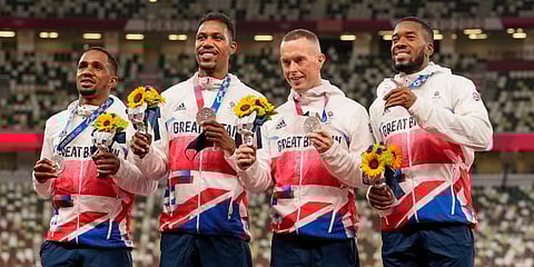 FILE - Silver medalist, team Britain, from left, Chijindu Ujah, Zharnel Hughes, Richard Kilty and Nethaneel Mitchell-Blake pose, during the medal ceremony in Tokyo, Aug 7, 2021. (Photo | AP)