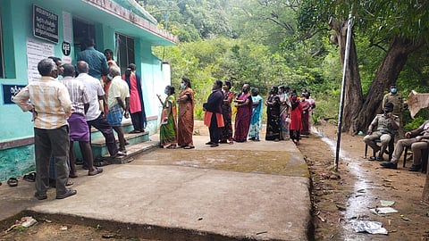 Residents of Kaani including from Injikuzhi cast their vote for the urban local body elections at the primary school in Papanasam Upper Dam on Saturday (Photo | Express)