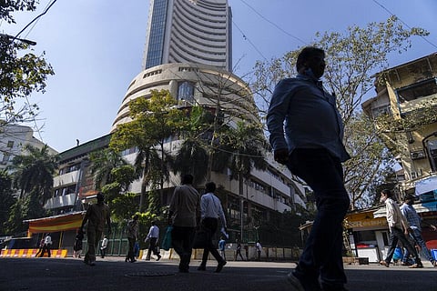 People walk past the Bombay Stock Exchange (BSE) building in Mumbai, India, Tuesday, Feb 1. 2022. (Photo | AP)