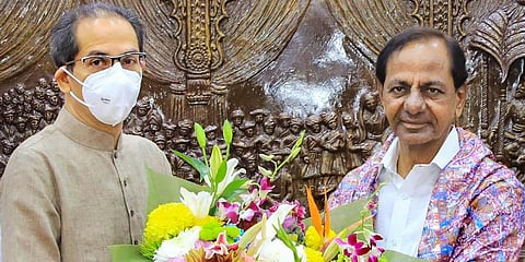 Telangana CM K Chandrasekhar Rao (R) interacts with Maharashtra CM Uddhav Thackeray in Mumbai. (Photo | PTI)