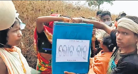 Villagers taking the ballot box from polling booth at Railima in Rayagada (Photo| Express)