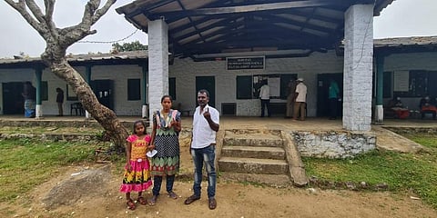 A family from Chunnambil division of Manjolai Tea Estate outside a polling booth at BBTC Primary School on Saturday, Feb 19, 2022. (Photo | EPS)