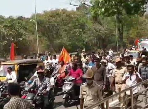 Body of the 26-year-old Bajrang Dal activist Harsha, who was allegedly murdered yesterday in Shivamogga, being taken to his residence amid Police security after postmortem. (Photo | ANI)