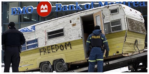 A camper is towed away by authorities clearing a trucker protest that was aimed at COVID-19 measures, in Ottawa on Sunday, February 20, 2022. (Photo: AP)