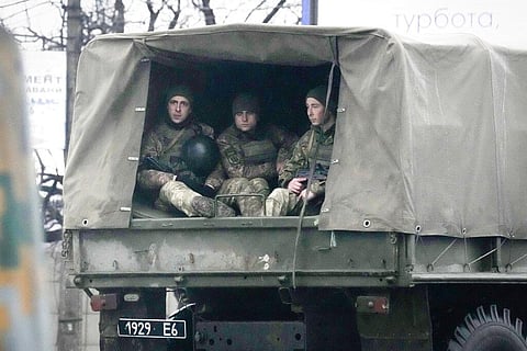 Ukrainian soldiers ride in a military vehicle in Mariupol, Ukraine, Thursday, Feb. 24, 2022. (Photo | AP)