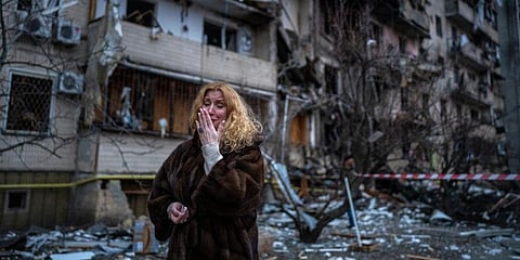 Natali Sevriukova reacts next to her house following a rocket attack the city of Kyiv, Ukraine. Image used for representational purpose. (Photo | AP)