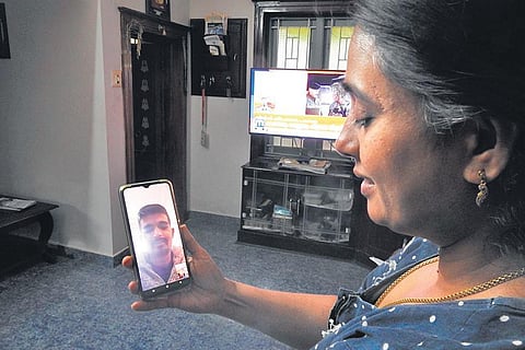 Archana talking to her son Girish via video call from their house at Valiyapadam in Palakkad. (Photo | EPS)