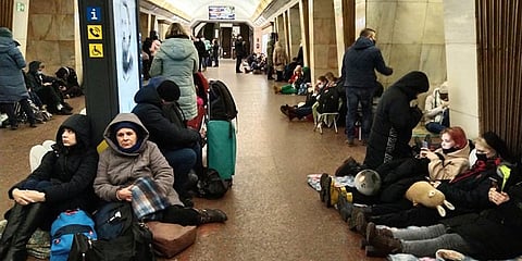 People sit in the Kyiv subway, using it as a bomb shelter in Kyiv, Ukraine, Thursday, Feb. 24, 2022. (Photo | AP)