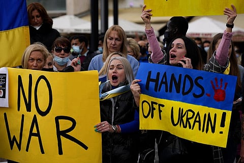 Ukrainian protesters, living in Cyprus, hold placards during a protest in support of Ukraine, at Eleptheria, Liberty square in central Nicosia, Cyprus. (Photo | AP)