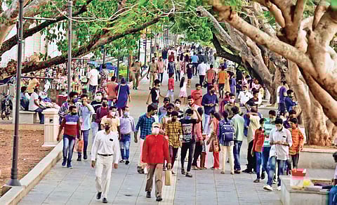 As the number of Covid cases records a dip in Kerala, people flock to the popular tourist spot of Marine Drive in Kochi | (Photo | EPS, Albin Mathew)