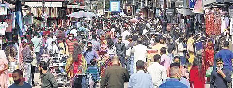 Crowd throngs the Central Market in Lajpat Nagar on Sunday after the government lifted all Covid-19 restrictions(Photo | Parveen Negi)