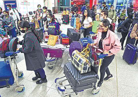 Those evacuated from Bucharest arrive at Delhi’s IGI Airport. (Photo | PTI)
