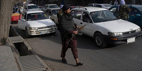 Taliban fighters check cars on a street in Kabul, Afghanistan. (Photo | AP)