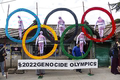 Exiled Tibetans use the Olympic Rings as a prop as they hold a street protest against the holding of 2022 Winter Olympics in Beijing in Dharmsala, India (Photo | AP)