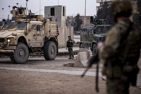 US soldiers stand guard in Hassakeh, northeast Syria, Thursday, Jan. 27, 2022. (Photo | AP)