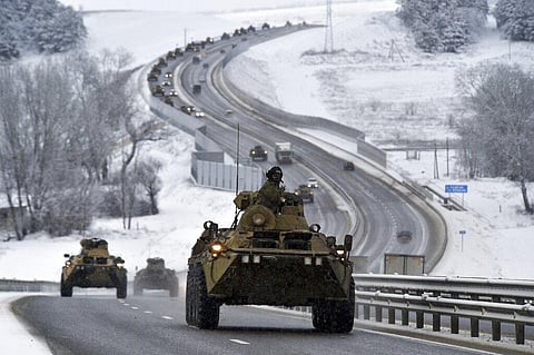A convoy of Russian armored vehicles moves along a highway in Crimea, Tuesday, Jan. 18, 2022. (Photo | AP)
