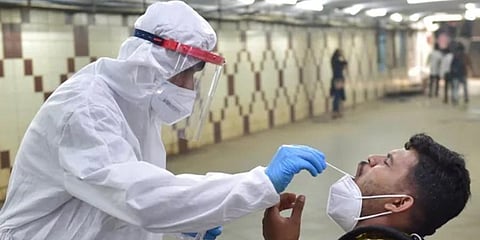 A health workers conducting a COVID-19 test. (Photo | PTI)