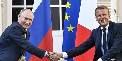French President Emmanuel Macron, right, shakes hands with Russian President Vladimir Putin.(File Photo | AP)