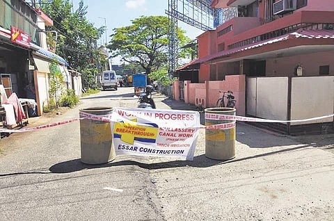 Barricade placed on an adjacent road as Mullassery canal renovation began on Saturday
