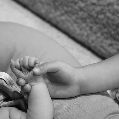 Jenner shared the happy news on her Instagram, alongside a black and white photo of her daughter Stormi holding the hand of the newborn. (Photo/ Instagram)