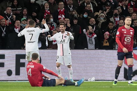 PSG's Lionel Messi, third from left, celebrates with his teammate Kylian Mbappe after scoring his side's third goal during the French League One soccer match. (Photo | AP)
