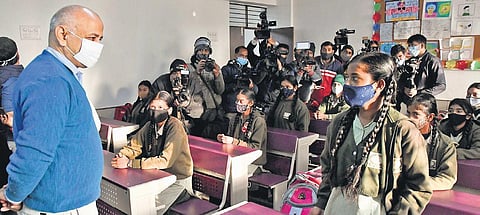 Education Minister Manish Sisodia interacts with students after schools reopened on Monday | shekhar yadav