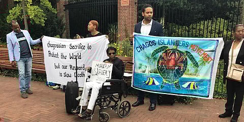 FILE - Protesters outside the World Court in The Hague, Netherlands, Sept. 3, 2018, where judges listen to arguments about the British claims to sovereignty over the Chagos Islands. (Photo | AP)