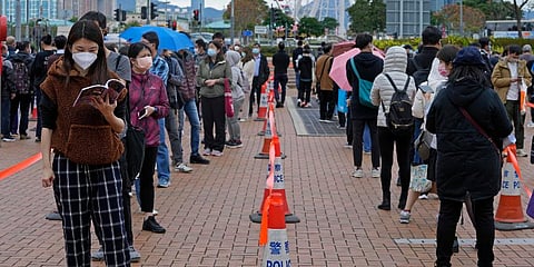 Residents line up to get tested for the coronavirus at a temporary testing center for COVID-19 in Hong Kong, Tuesday, Feb. 8, 2022. (Photo | AP)