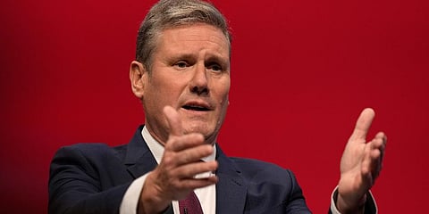 Leader of the British Labour Party Keir Starmer gestures as he makes his keynote speech at the annual party conference in Brighton, England, Sept. 29, 2021.