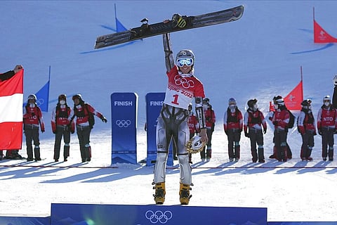 Gold medalist Czech Republic's Ester Ledecka celebrates during the venue ceremony for the women's parallel giant slalom at the 2022 Winter Olympics. (Photo | AP)