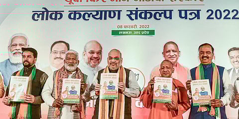 Union Minister Amit Shah, Uttar Pradesh CM Yogi Adityanath and others release 'Lok Kalyan Sankalp Patra' in Lucknow. (Photo| ANI)