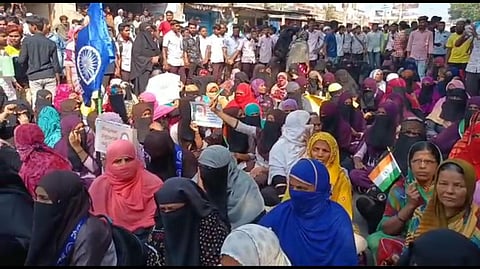 Muslims students and their parents staged a protest in front of the college premises in Banahatti town on Tuesday. (Photo | EPS)